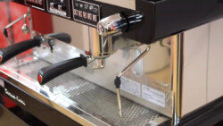 Right side look of Astoria Pratic Avant semi-automatic coffee machine in black color showing steam wand