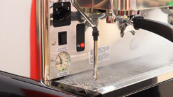 Steam wand, water dispenser, boiler & brewing pressure gauge of Astoria Pratic Avant present at left side of coffee machine